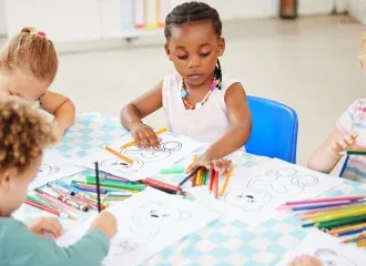 diverse-group-of-children-sitting-at-a-table-and-c-2025-04-06-11-22-58-utc